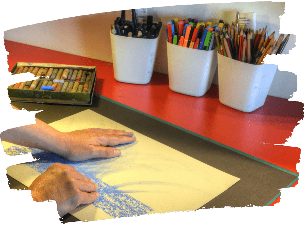 Creative therapy can be about exploring like the counsellor is showing how to use pastels, movement and colour to explore emotions.