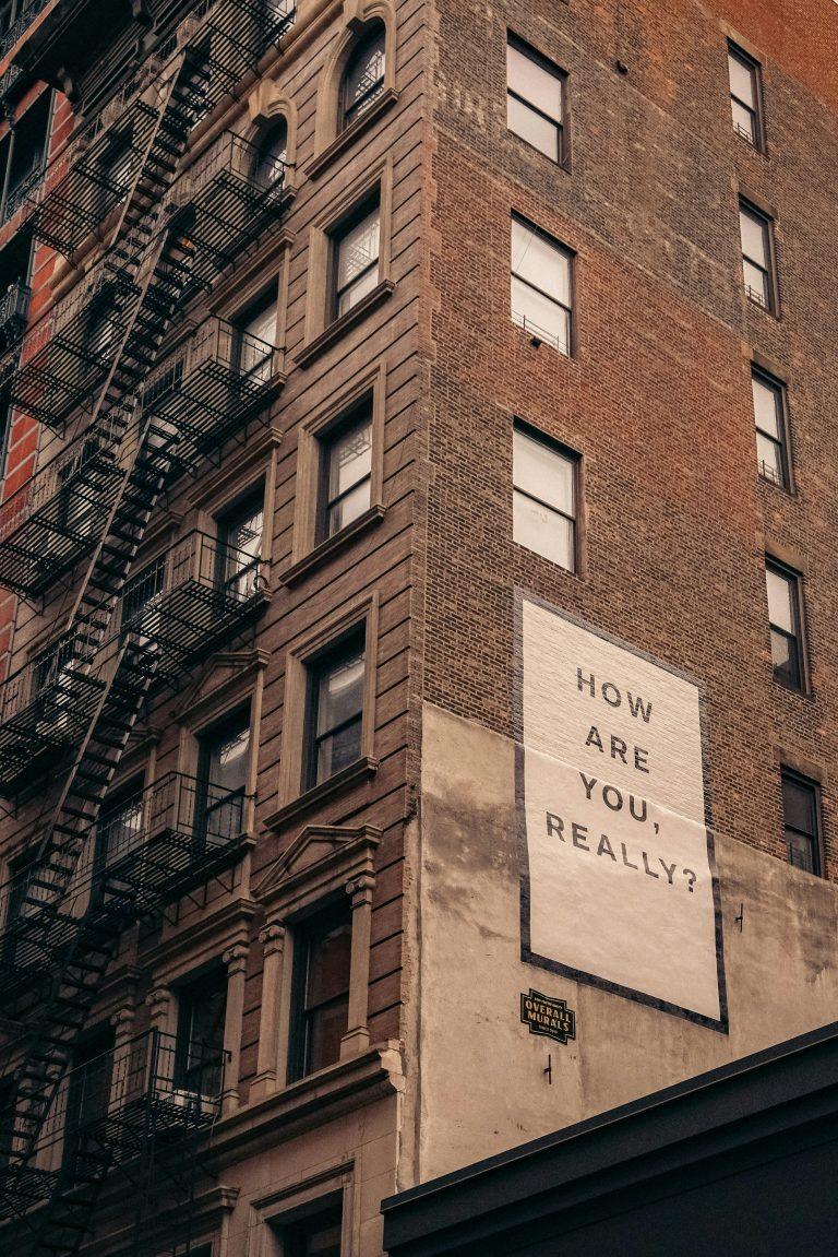 Is therapy right for me? Counselling starts with a question, like this one on tall monotone building: how are you, really?